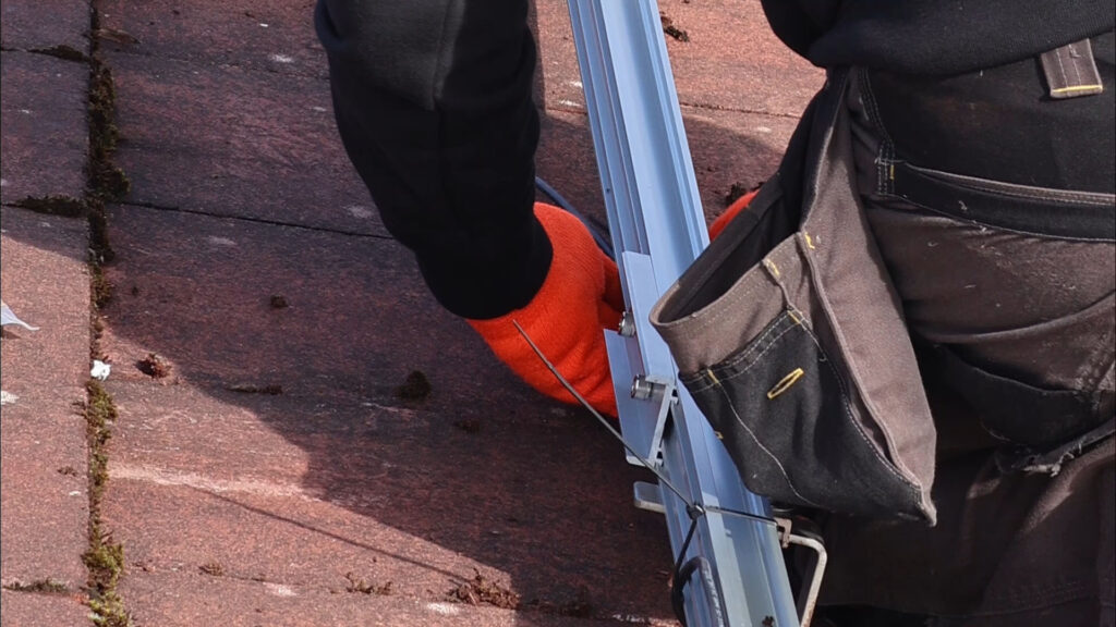 man installing a solar panel