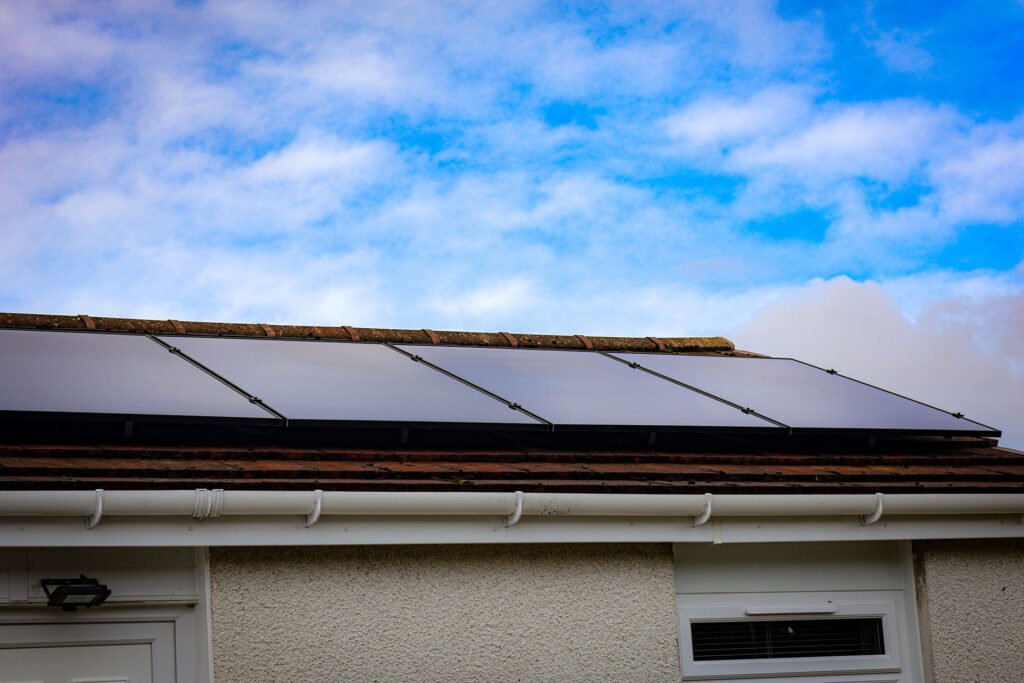 row of solar panels on a roof